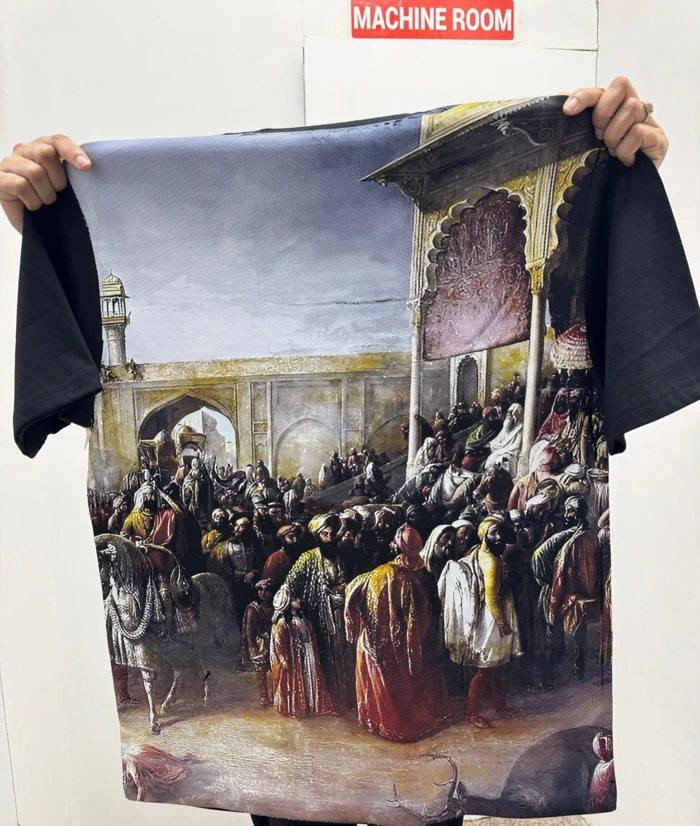Halftone DTF print with architectural and crowd details on a black T-shirt